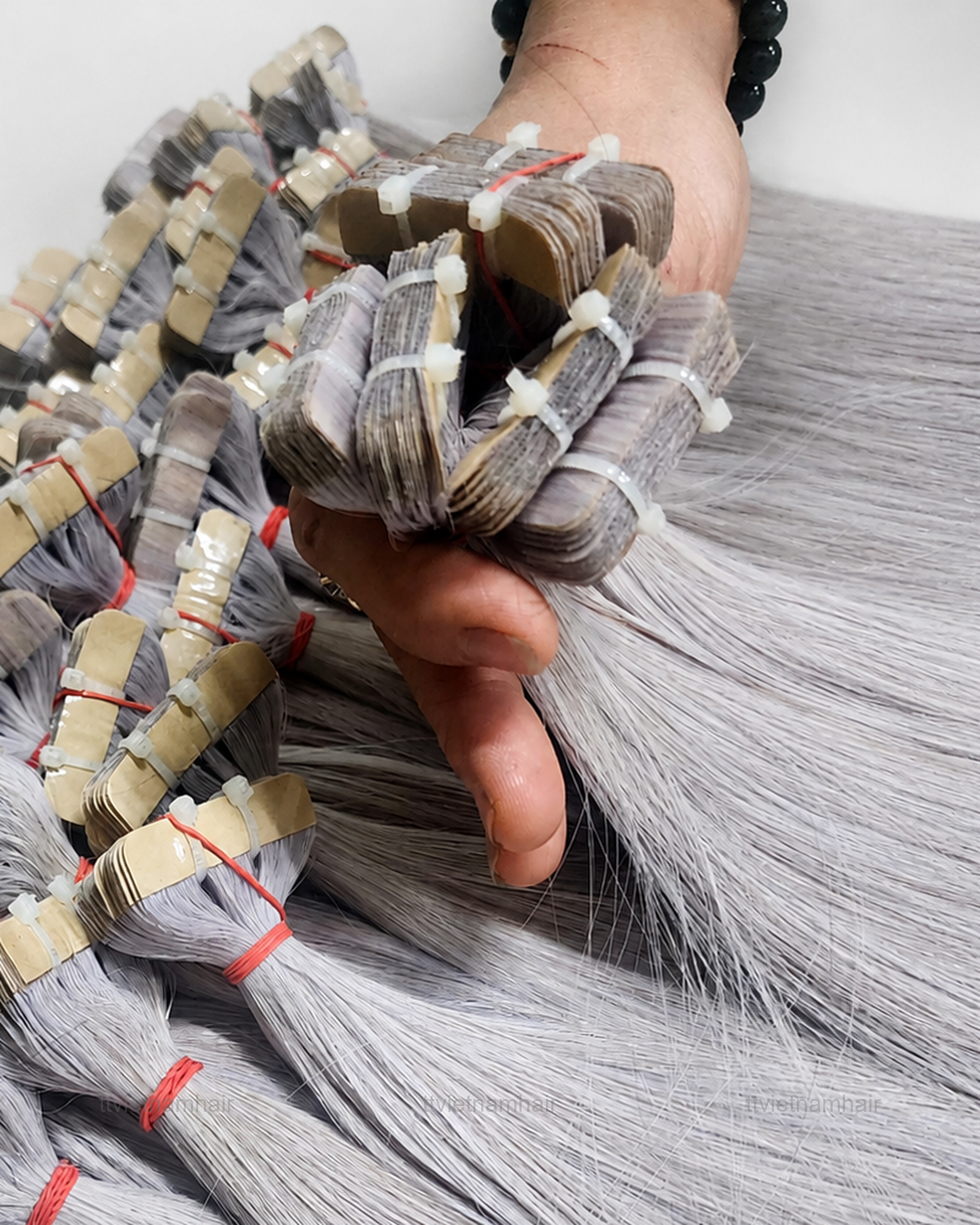 Silver Grey Bone Straight Tape-In Hair Extensions by T&T VIETNAMHAIR